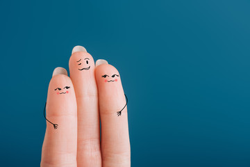 cropped view of cheerful human fingers isolated on blue