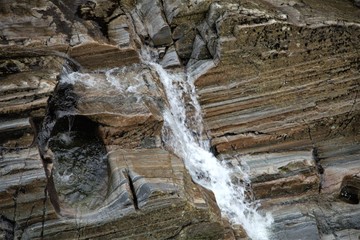Natural stone bath at the waterfall.