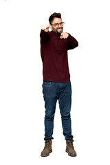 Fototapeta premium Full-length shot of Handsome man with glasses points finger at you while smiling on isolated white background