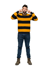 Full-length shot of Handsome man with striped sweater having doubts and thinking on isolated white background