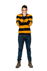 Fototapeta premium Full-length shot of Handsome man with striped sweater smiling a lot on isolated white background