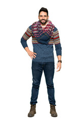 Fototapeta premium Full-length shot of Hippie man posing with arms at hip and smiling on isolated white background