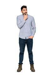 Full-length shot of Elegant man with shirt smiling and looking to the front with confident face on...
