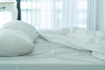 Bed maid-up with clean white pillows and bed sheets in beauty bedroom. Close-up. interior background