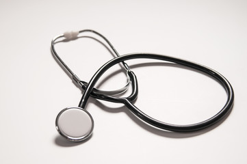 Fototapeta premium Close up view of black stethoscope on white back