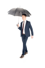 smiling stylish businessman posing with umbrella isolated on white