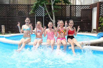 Children swim in  pool