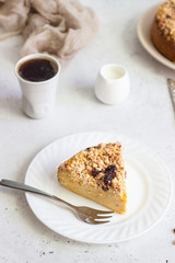 Cheesecake with pumpkin and crumble. No crust cheesecake. Healthy dessert. Light concrete background. Copy space.