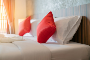 Bed maid-up with clean white pillows and bed sheets in beauty bedroom. Close-up. interior background