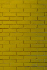 It is a wall background from bricks of flavovirent color.