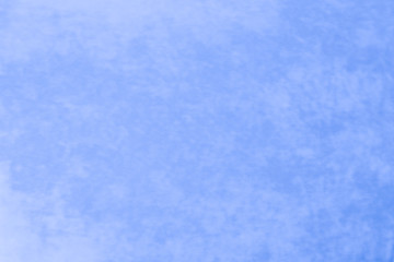 It is a background of fabric of beautiful blue color of non-uniform texture.