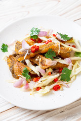 crispy gourami fish with spicy salad