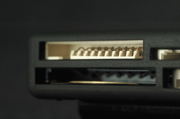 Card reader. Ports for various memory card formats closeup. Shallow depth of field