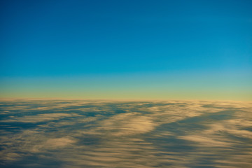 blue sky over fluffy clouds 