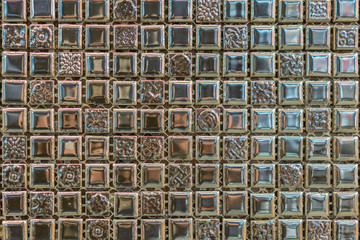 abstract square pixel mosaic wall background and texture. brown glass mosaic tile background pattern