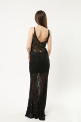 Full length photo of fashion model woman wearing elegant evening dress black gown posing isolated...