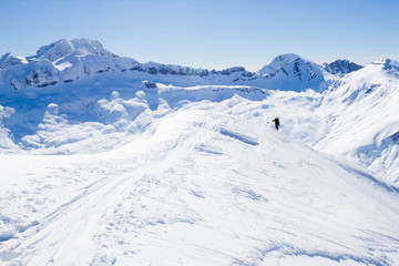 Fototapeta na wymiar skier going up a mountain in a touring ski day