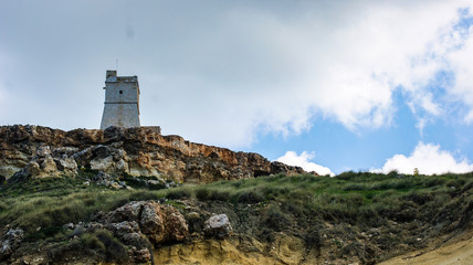 Fototapeta na wymiar Watch tower on the cliff top.