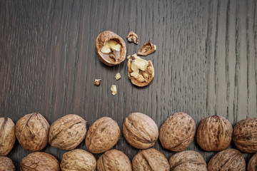 Walnuts on a dark wooden table