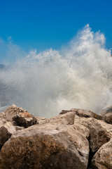 Sea waves break on the rocks - Breakwater and splash