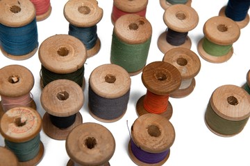 Fototapeta premium wooden coils with colorful threads of pastel colors