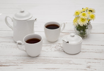 teatime cups of tea on wooden white table