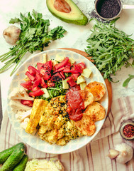 Green fresh salad with tomatoes, pink lentil mashed potatoes, baked potato slices with homemade ketchup.Vegetarian colorful lunch. Top view.