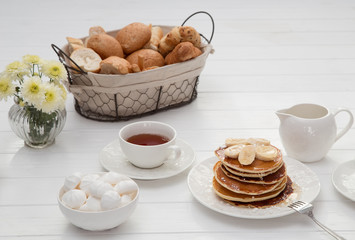 Breakfast with pancakes and tea