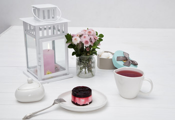 tea set on a white table, tea