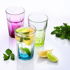 Classic lemonade with mint and lemon slices on light background