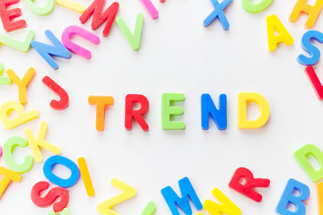 Trends concept. Coloured letters on white background. Be in trend