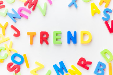 Trends concept. Coloured letters on white background. Be in trend