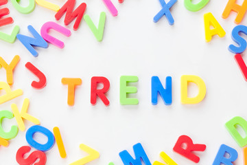 Trends concept. Coloured letters on white background. Be in trend