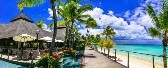 Papier Peint photo Le Morne, Maurice Relaxing  bar in palm shade and pool bnear the beach. tropical paradise Mauritius island