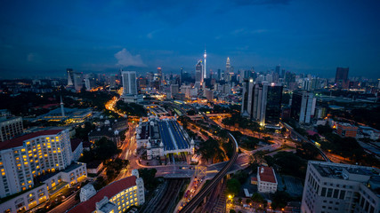 Cloudy sunset over Kuala Lumpur City Skyline showing the transportation arteries withing the heart of the city's transportation hub.