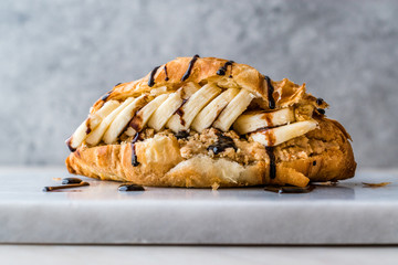 Croissant Sandwich with Banana, Peanut Butter and Chocolate Sauce.