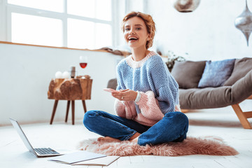 Happy cheerful woman chatting in social networks