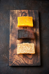 Collection of handmade soap on wooden board