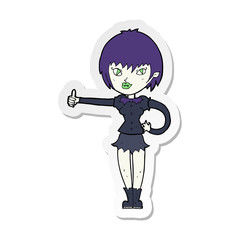 sticker of a cartoon vampire girl giving thumbs up sign