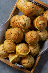 Homemade banana muffins on wooden tray. 