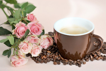 brown coffee Cup, tea roses and coffee beans