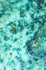 View from above, stunning aerial view of a beautiful transparent and turquoise sea that creates a natural pattern, Phi Phi Island, Thailand.