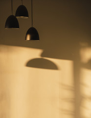 Three black metal lamps