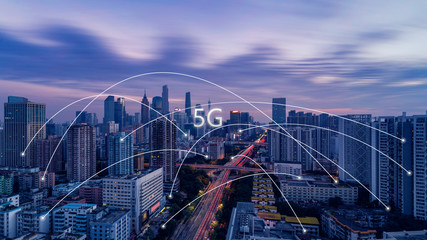 5G network wireless systems and internet of things with modern city skyline