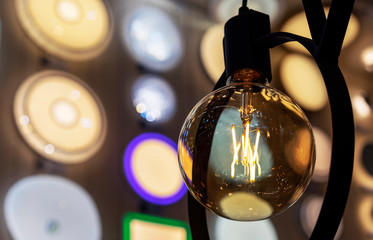 Round light bulb with dark glass in a loft style.
