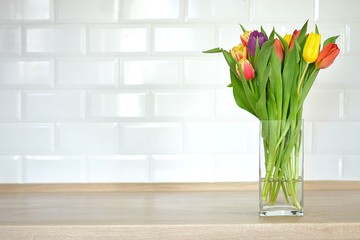 bouquet of tulips on a tray and in the background 