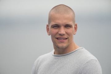 Outdoor portrait of young caucasian adult male