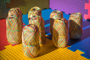 Knitting skein on a multicolored background.