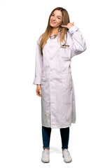 Full body Young doctor woman making phone gesture. Call me back sign on isolated background