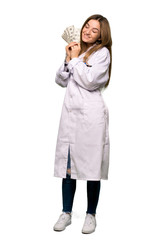 Full body Young doctor woman taking a lot of money on isolated background